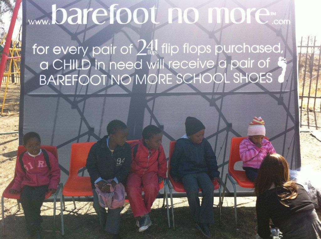 khulusa school 4 - being fitted with school shoes